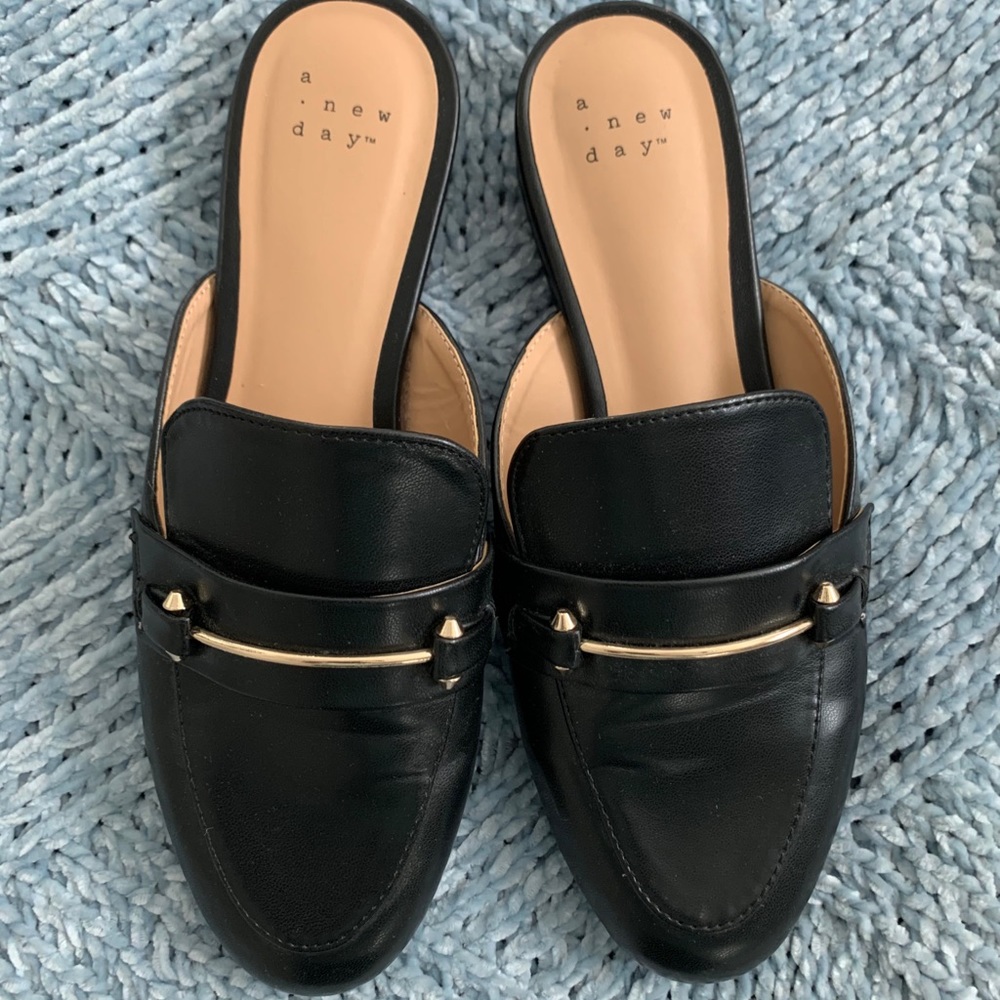 a new day black and gold backless loafers